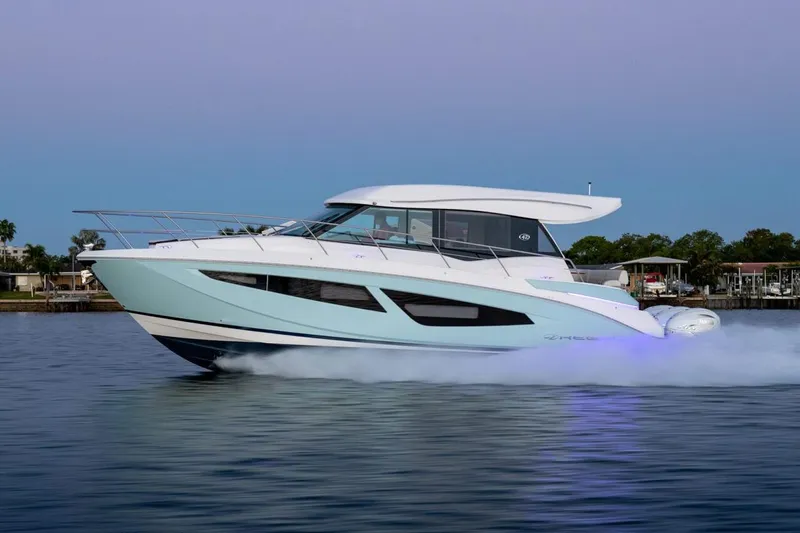 The Image of Manufacturer Provided Image: 2026 Regal 42 XO yacht cruising on calm waters at sunset. - 0