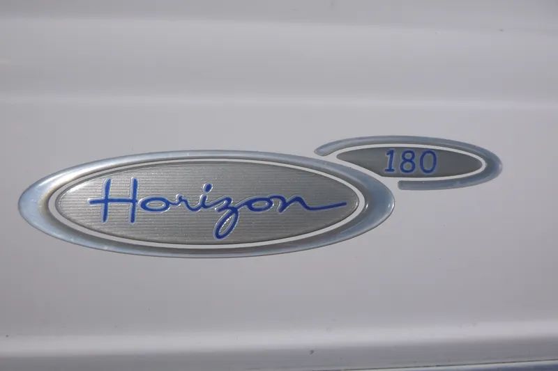 Slide: The Image of 2007 Four Winns 180 Horizon logo on boat exterior. - 13