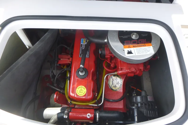 Slide: The Image of Engine compartment of 2007 Four Winns 180 Horizon boat, featuring a 3.0 GL engine. - 12