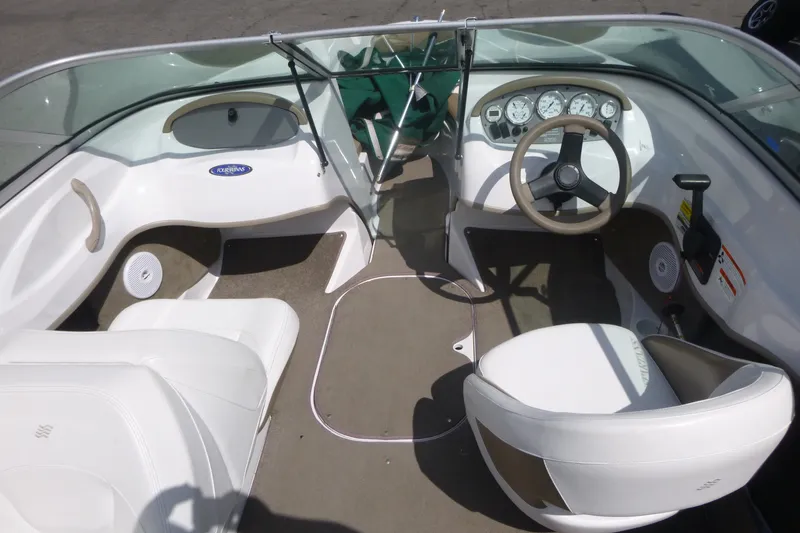 Slide: The Image of 2007 Four Winns 180 Horizon boat interior with steering wheel and dashboard. - 4