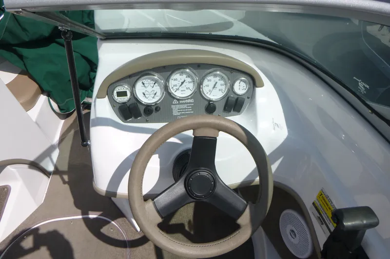 Slide: The Image of Steering console of 2007 Four Winns 180 Horizon boat with gauges and controls. - 8