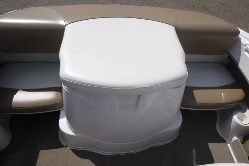 Slide: The Image of 2007 Four Winns 180 Horizon boat interior seating with beige and white upholstery. - 11