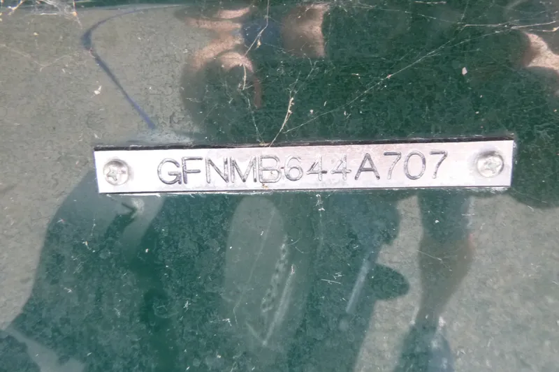 Slide: The Image of 2007 Four Winns 180 Horizon boat identification plate with serial number GFNMB644A707. - 14