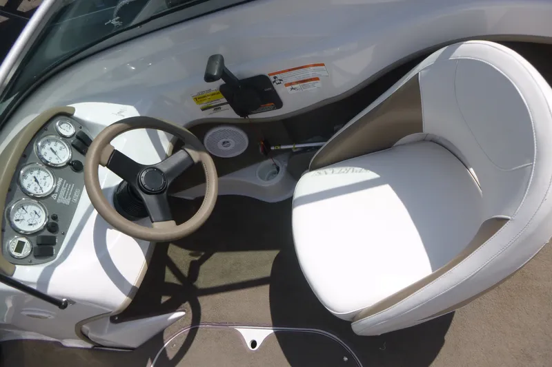 Slide: The Image of 2007 Four Winns 180 Horizon boat interior with steering wheel and gauges. - 7