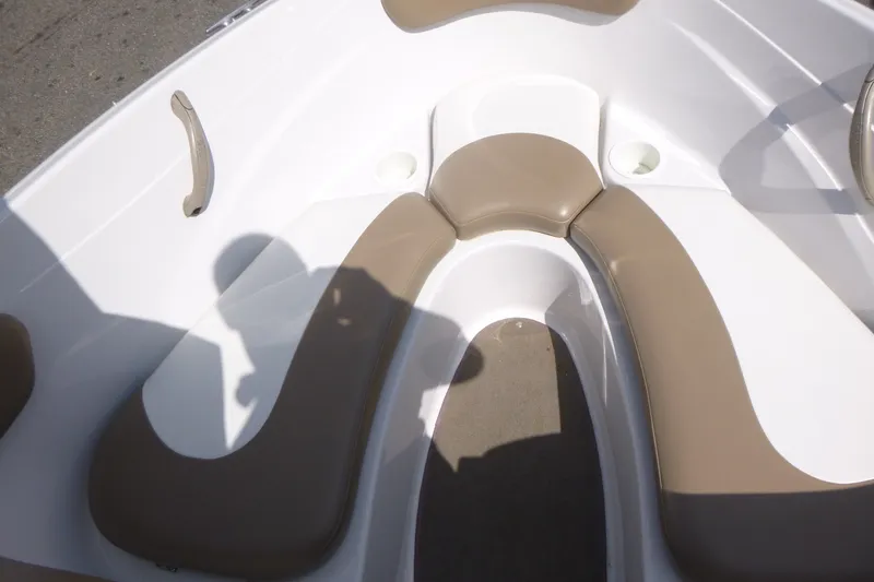 Slide: The Image of 2007 Four Winns 180 Horizon boat interior with beige seating and white deck. - 6