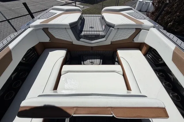 Slide: The Image of 2022 Nautique Super Air Nautique G25 interior with luxurious seating and modern design. - 23