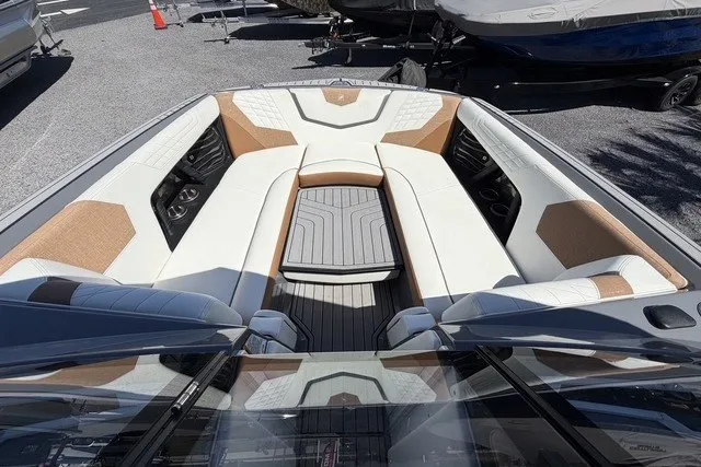 Slide: The Image of 2022 Nautique Super Air Nautique G25 boat interior with luxurious seating and modern design. - 17