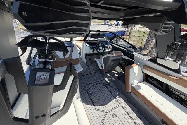 Slide: The Image of Interior of 2022 Nautique Super Air Nautique G25 boat, featuring modern seating and sleek design. - 19