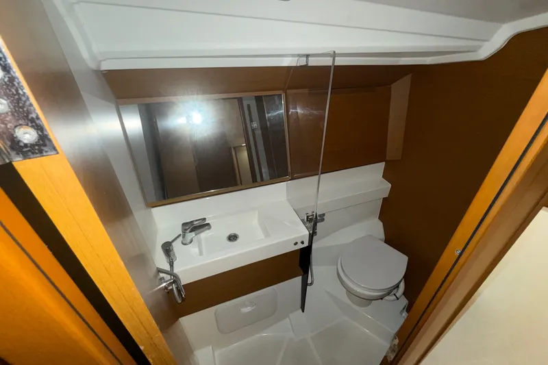 Slide: The Image of Modern bathroom in 2022 Jeanneau Sun Odyssey 410 yacht, featuring sleek fixtures and wood accents. - 37