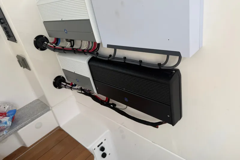 Slide: The Image of Electrical components and wiring inside a 2021 Everglades 335 Center Console boat. - 25