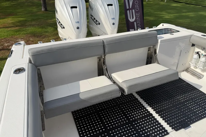 Slide: The Image of 2021 Everglades 335 Center Console boat with dual Yamaha engines and cushioned seating. - 9