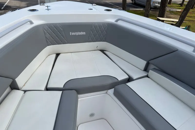 Slide: The Image of 2021 Everglades 335 Center Console boat with gray and white cushioned seating. - 18