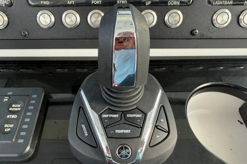 Slide: The Image of Control panel of 2021 Everglades 335 Center Console boat with joystick and buttons. - 15