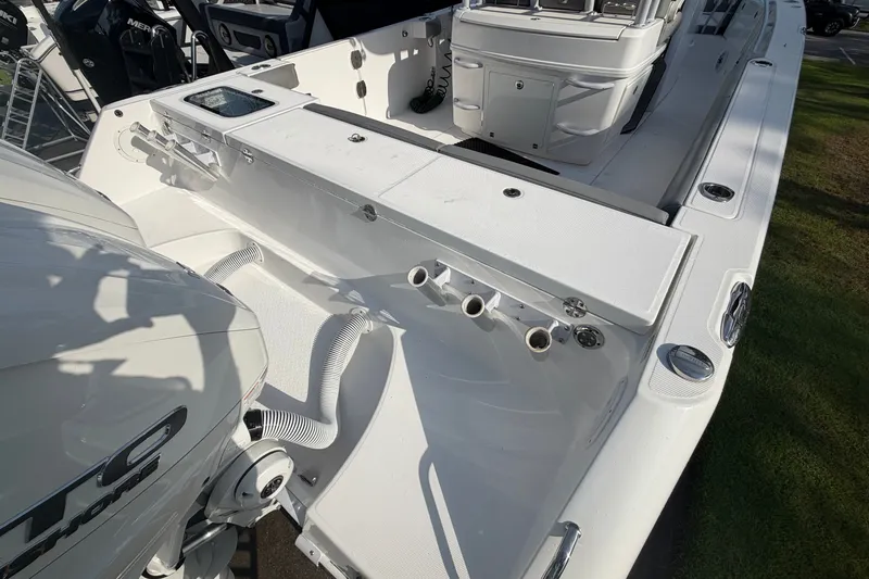 Slide: The Image of 2021 Everglades 335 Center Console boat deck with seating and storage features. - 4