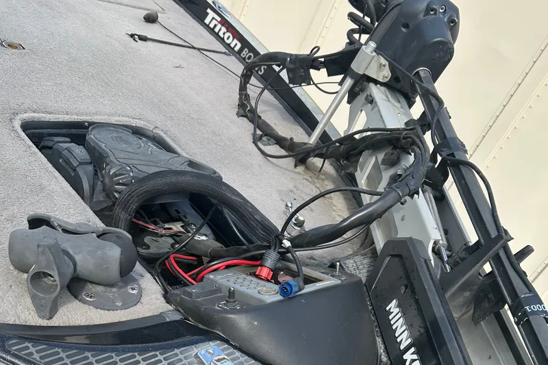 Slide: The Image of Triton 21 TrX 2006 boat deck with wiring and trolling motor components. - 7