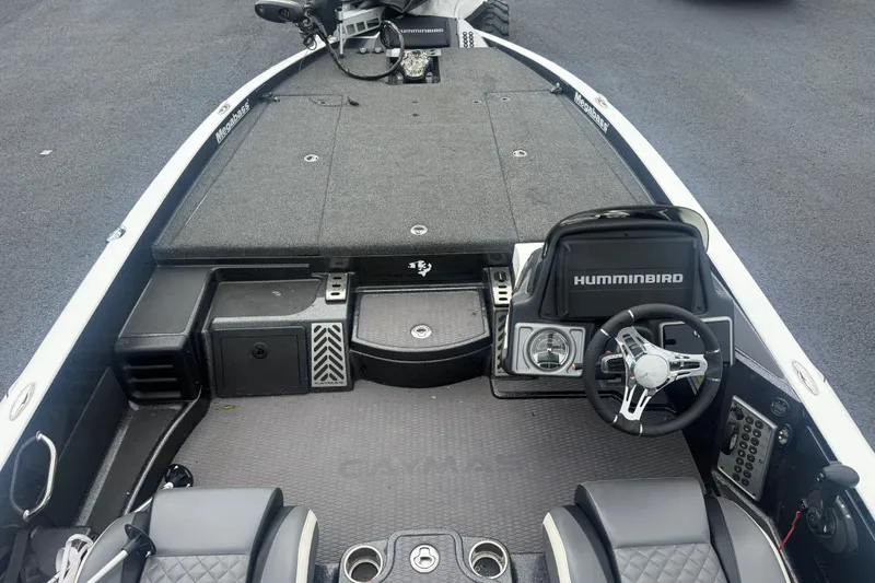 Slide: The Image of 2020 Caymas CX 20 PRO boat interior with steering wheel and Humminbird electronics. - 11