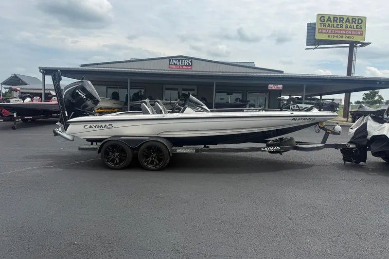 The Image of 2020 Caymas CX 20 PRO boat on trailer at dealership, overcast sky. - 1