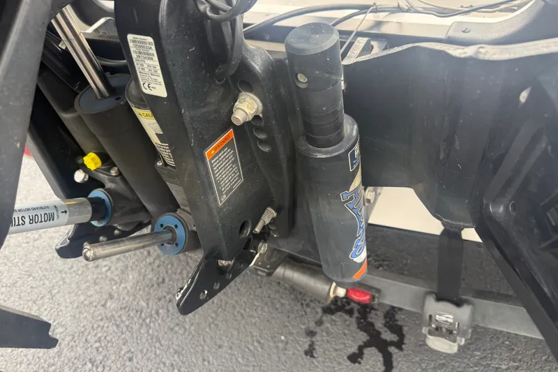 Slide: The Image of Close-up of 2020 Caymas CX 20 PRO boat motor components on a wet surface. - 7