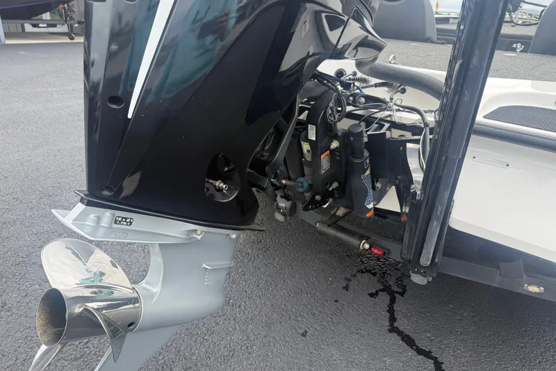 Slide: The Image of 2020 Caymas CX 20 PRO boat engine and propeller detail on asphalt surface. - 6