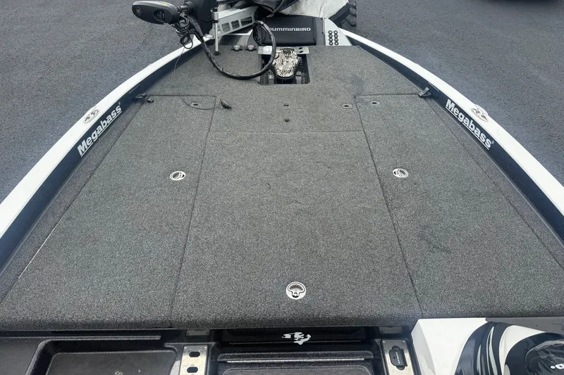 Slide: The Image of 2020 Caymas CX 20 PRO boat deck with Megabass branding and Humminbird equipment. - 13