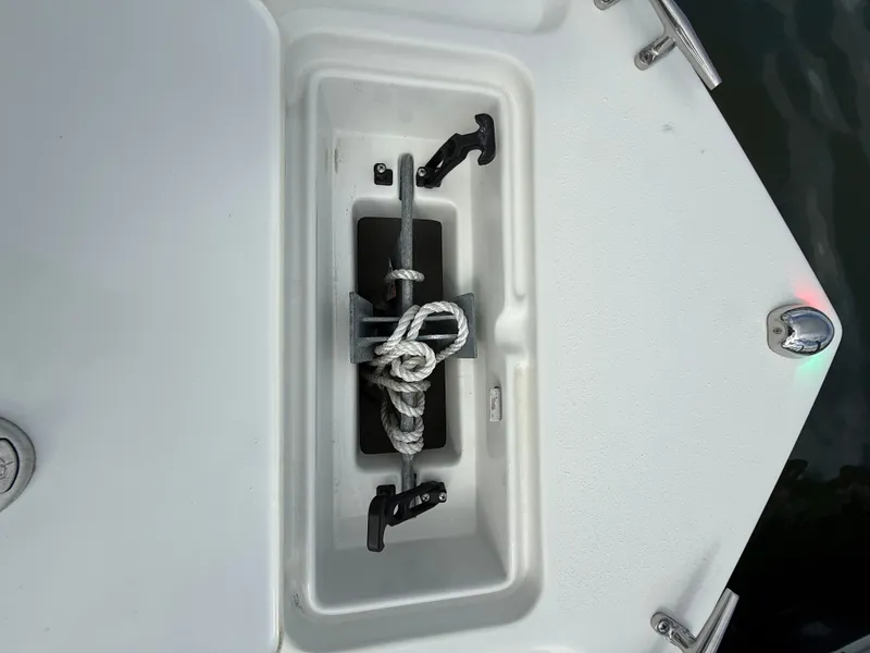 Slide: The Image of An anchor with rope is stored in a compartment on a Parker 1801 Center Console boat. - 19