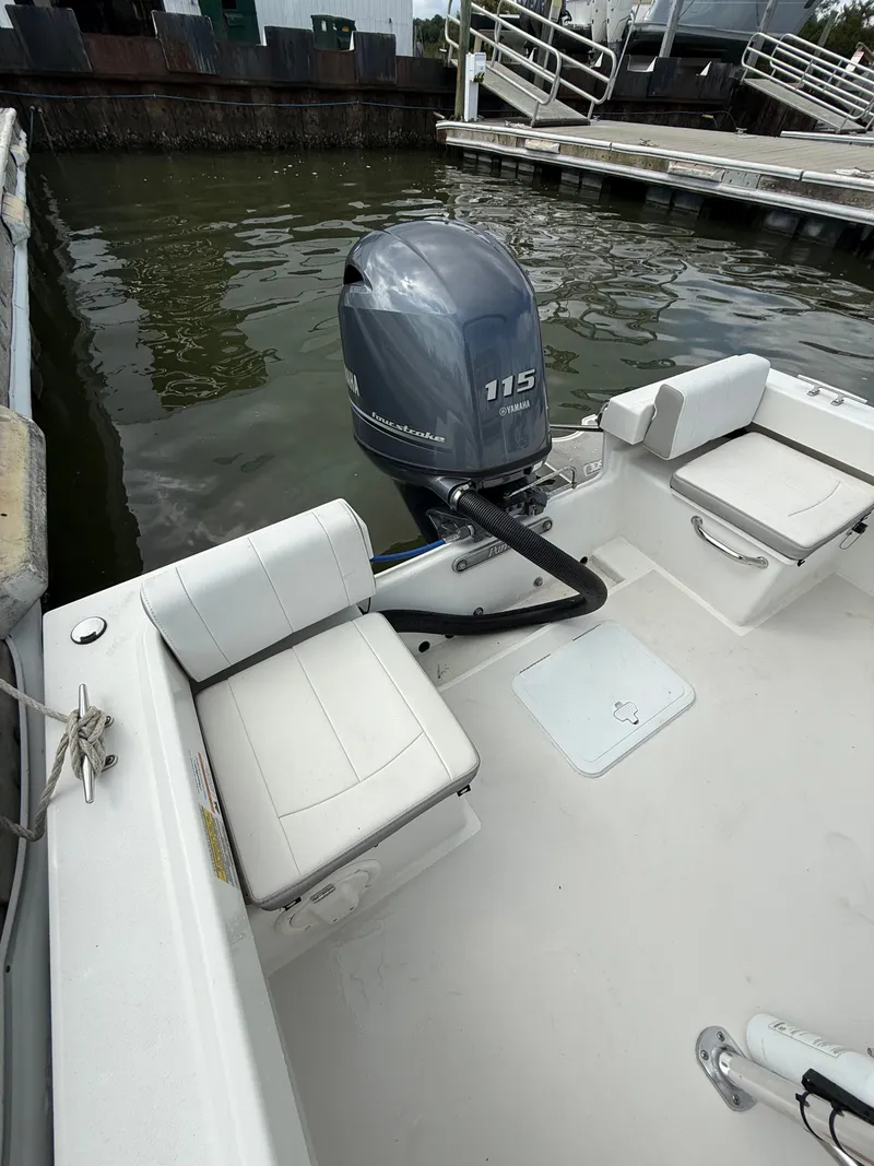 Slide: The Image of A 2023 Parker 1801 Center Console boat with a 115 HP outboard motor. - 24