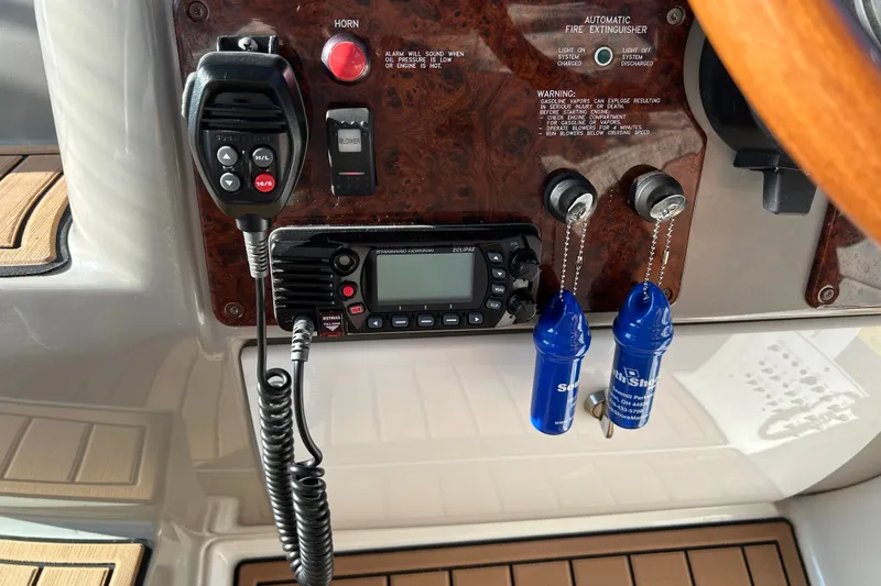Slide: The Image of Control panel of a 2005 Formula 34 Performance Cruiser with radio and safety features. - 14