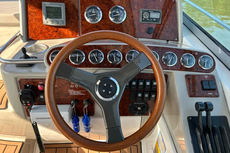 Slide: The Image of 2005 Formula 34 Performance Cruiser dashboard with wood accents and modern gauges. - 10