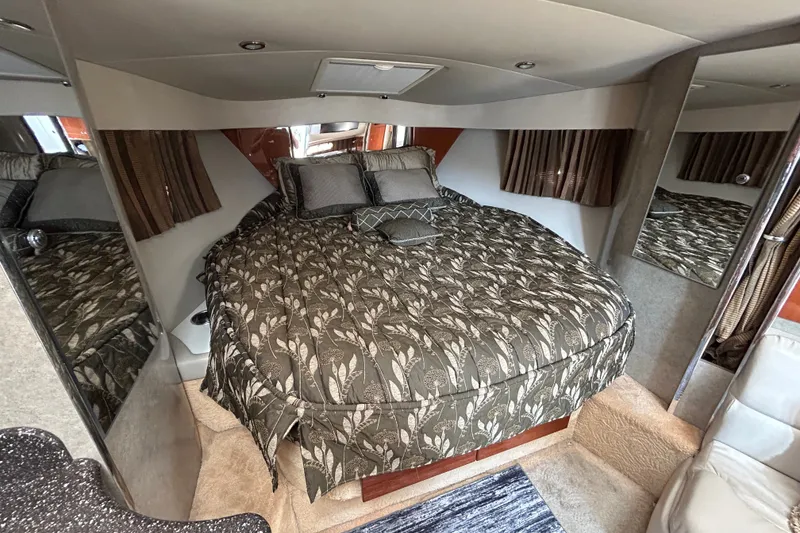 Slide: The Image of Interior of 2005 Formula 34 Performance Cruiser with cozy bed and elegant decor. - 17