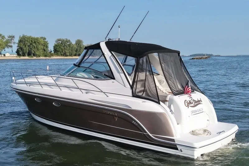 Slide: The Image of 2005 Formula 34 Performance Cruiser on water, featuring sleek design and black canopy. - 3
