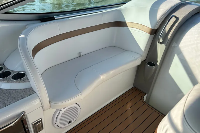 Slide: The Image of Interior of a 2005 Formula 34 Performance Cruiser with white seating and wood flooring. - 7