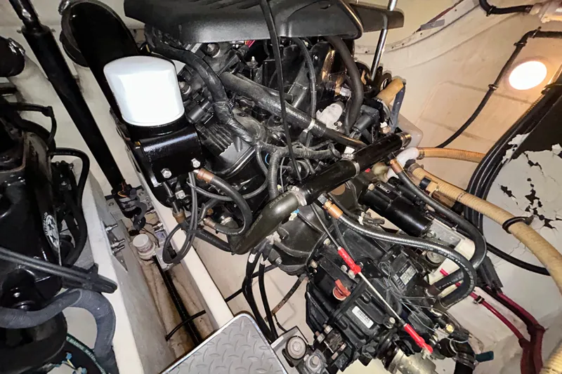 Slide: The Image of Engine compartment of a 2005 Formula 34 Performance Cruiser, showcasing intricate mechanical components. - 26