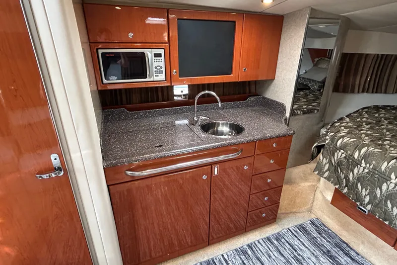 Slide: The Image of 2005 Formula 34 Performance Cruiser interior with kitchenette and bed. - 16