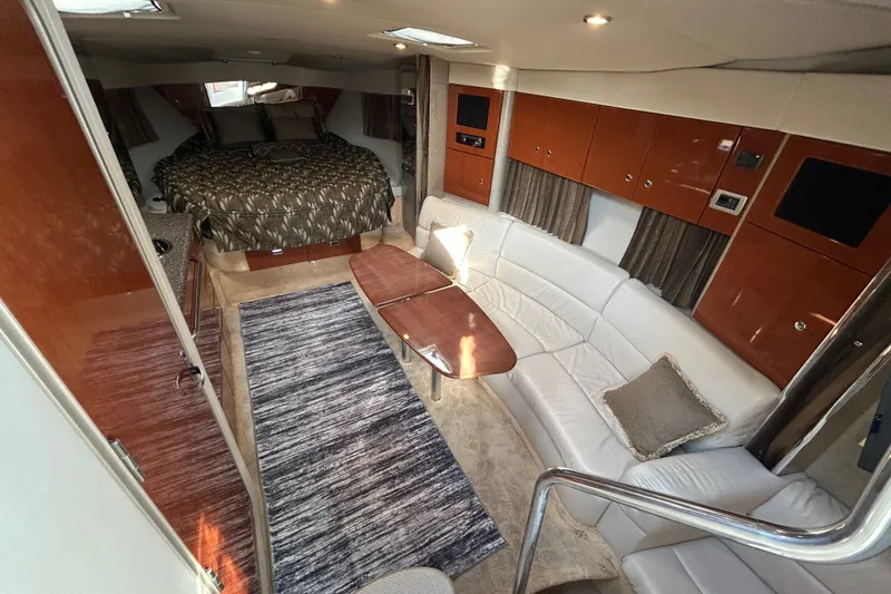 Slide: The Image of Luxurious interior of a 2005 Formula 34 Performance Cruiser with elegant seating and cozy sleeping area. - 15