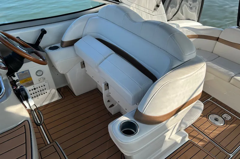 Slide: The Image of 2005 Formula 34 Performance Cruiser cockpit with white seating and wood accents. - 8