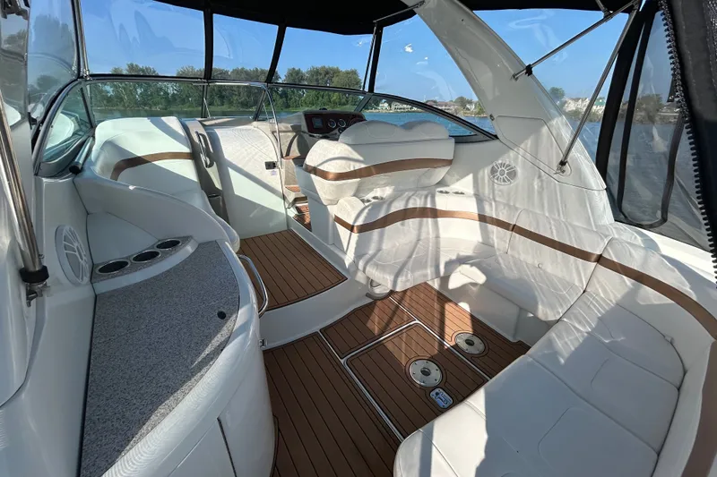 Slide: The Image of Interior of 2005 Formula 34 Performance Cruiser with white seating and wood flooring. - 4