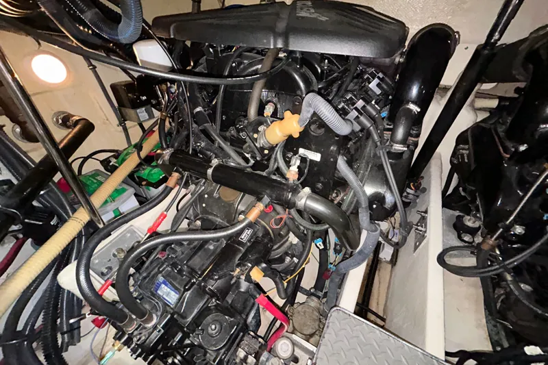 Slide: The Image of Engine compartment of a 2005 Formula 34 Performance Cruiser, showcasing intricate mechanical components. - 27