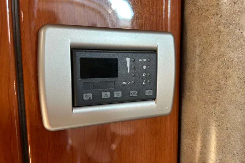 Slide: The Image of Control panel on 2005 Formula 34 Performance Cruiser, mounted on wooden interior. - 24