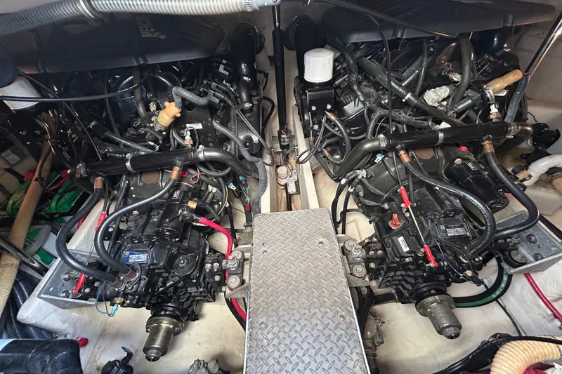 Slide: The Image of Engine compartment of a 2005 Formula 34 Performance Cruiser, showcasing dual engines and mechanical components. - 25