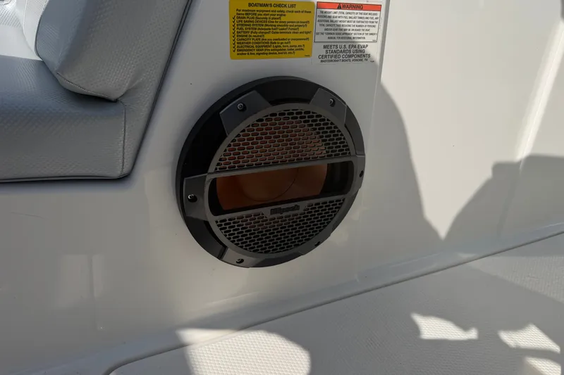 Slide: The Image of 2019 MasterCraft NXT20 boat interior with speaker and safety instructions. - 16