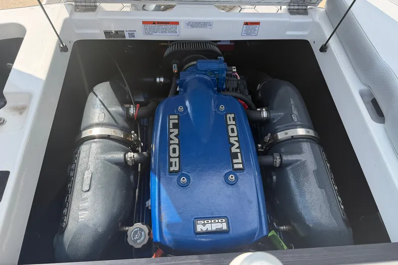 Slide: The Image of 2019 MasterCraft NXT20 engine compartment featuring Ilmor 5000 MPI engine. - 21