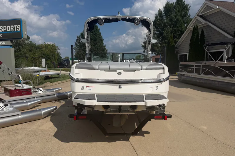 Slide: The Image of 2019 MasterCraft NXT20 boat parked outdoors on a sunny day. - 2