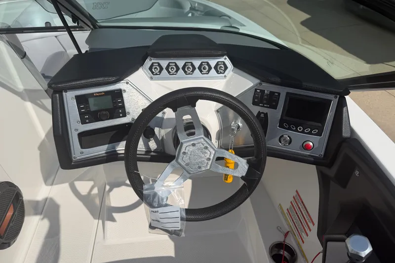 Slide: The Image of Dashboard of a 2019 MasterCraft NXT20 boat with steering wheel and controls. - 4