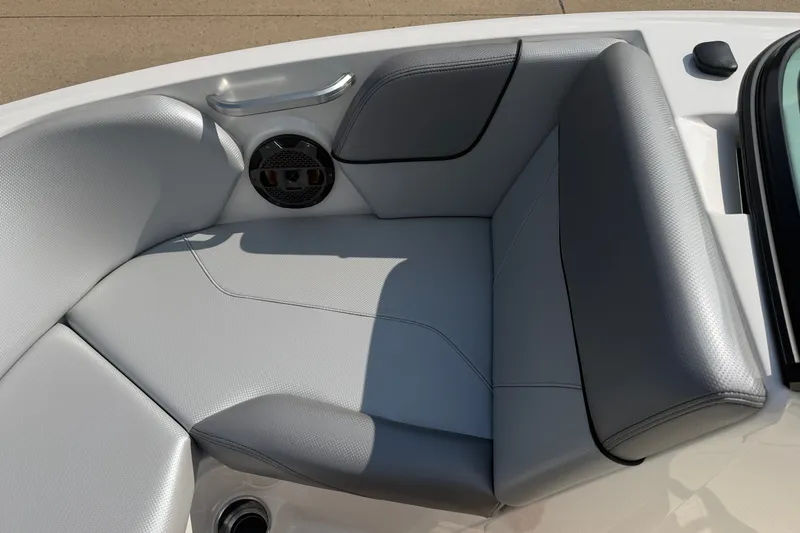 Slide: The Image of 2019 MasterCraft NXT20 boat interior with gray seating and speaker detail. - 20