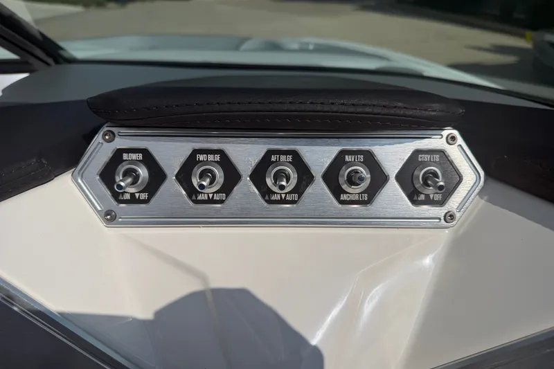 Slide: The Image of Control panel of a 2019 MasterCraft NXT20 boat with labeled switches. - 8