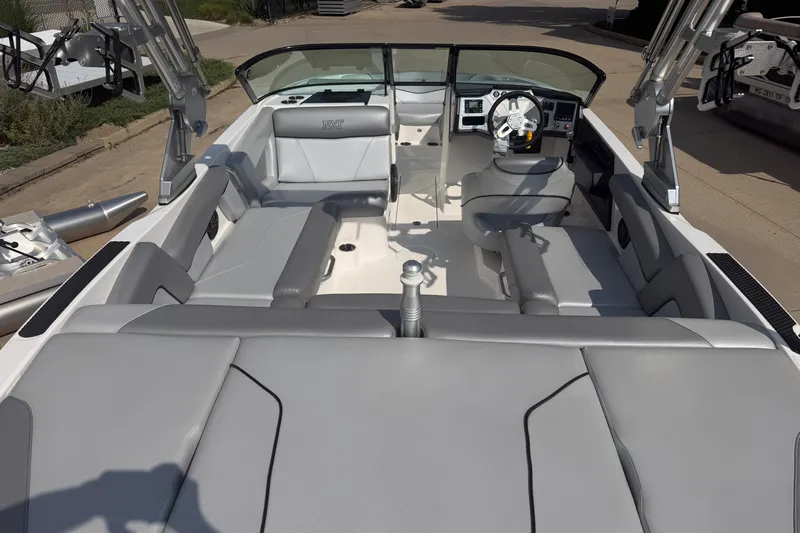 Slide: The Image of 2019 MasterCraft NXT20 boat interior with gray seating and modern dashboard. - 3