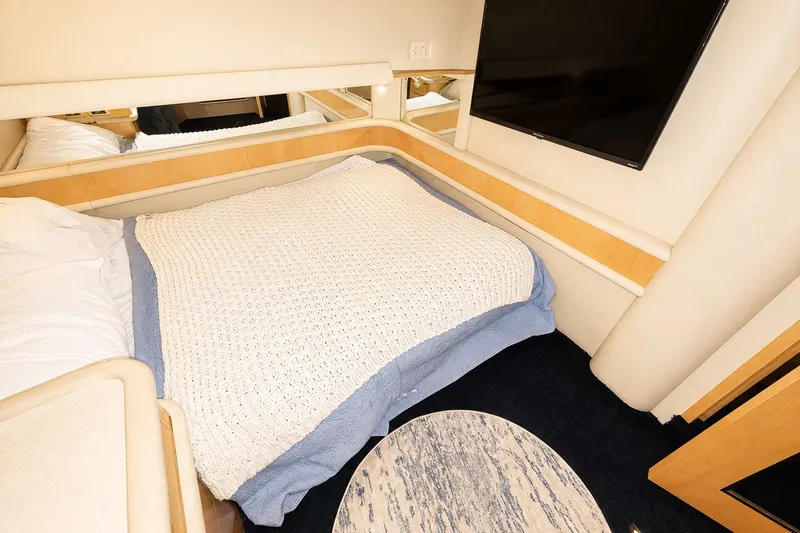 Slide: The Image of Luxurious bedroom interior of 2001 Sea Ray 560 Sedan Bridge yacht. - 25