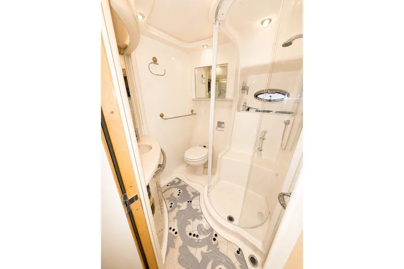 Slide: The Image of Luxurious bathroom in 2001 Sea Ray 560 Sedan Bridge yacht with shower and modern fixtures. - 27