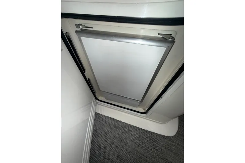 Slide: The Image of Interior view of a 2001 Sea Ray 560 Sedan Bridge refrigerator door. - 13
