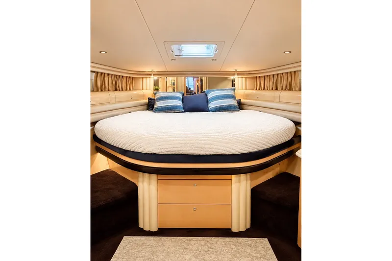 Slide: The Image of Luxurious bedroom interior of 2001 Sea Ray 560 Sedan Bridge yacht. - 21